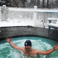 man in hot tub winter