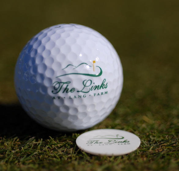 Golf ball with The Links at Lang Farm logo